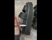 Using yellow marker to color in stitching of sandals