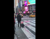 Guy speaks on mic with rat in bag 