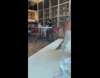 Boy takes photo woman inside the restaurant