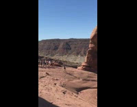 Group of people line up jump sideways domino effect