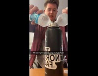 Guy uses plastic bottles to fill hydroflask 