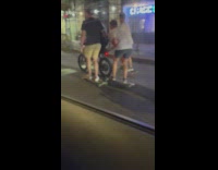 Motorcycle pull three guys on long board