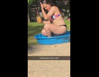 Woman bikini mini plastic pool drinks photo shoot