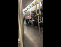 Aggressive Black Dog Pulls Umbrella from Man