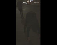 Guy on Sidewalk at Night Tries to Leap Frog Friend Faceplants