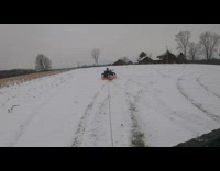 Car pulls two kids on inflatable tube