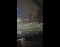 Car stuck behind ATVs and dirt bikes 