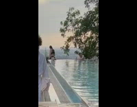 Woman black bikini climb up water pool