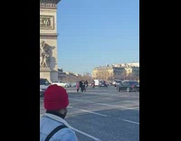 Woman in black sweater poses in the middle of the road