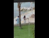 Woman glitter dress arm tattoo peace sign