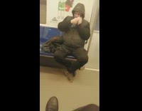 Man spray disinfectant to his face subway