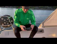 Man controls and flies the drone to the water