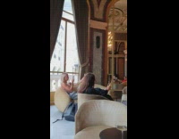 Timelapse of two women taking selfies in fancy room