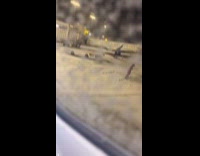 Airport worker spells out safe flight snow