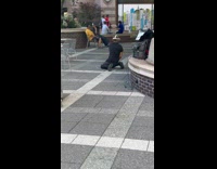 Collab Subway Creatures - Man kneel on ground play with VR headset