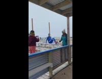 Blue tracksuit beanie white picnic table girl