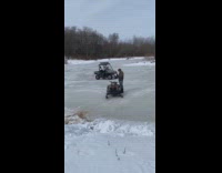 Guy drive cart spin skid frozen lake