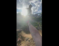 Guy opens beer bottle with bike tire 