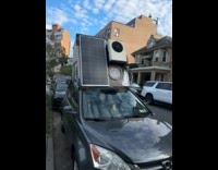 Car with custom camper on its roof