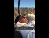 Guy gets bit by dog friend laughs 