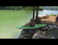 Man rides kayak off ledge tips over