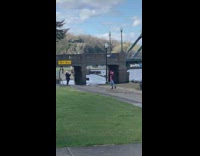 Girl baggy shirt spin hula hoop park