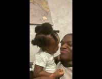 Baby kisses father after staring in eyes