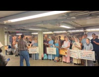 Religious group singing at subway station