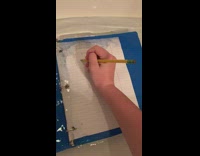 Blue binder writing on paper homework bath tub