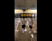 Rain enters subway cause puddle on floor
