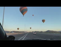 Hot Air Balloon on the highway road drive