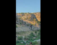 Woman raise one feet up at the bridge