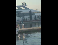 Woman silver leotard walk yacht dock beach