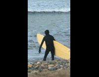 Full Black Wetsuit Yellow Surfboard Slowly Climbs Into Ocean