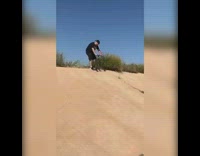 Man rides scooter down empty water reservoir and falls down