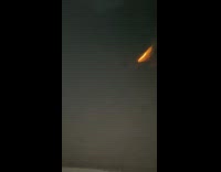 Barefoot guy gets hit red cube firework 