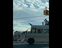 Bus has cone and rainbow decorations 