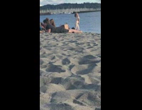 Woman white off shoulder pose on beach part 1