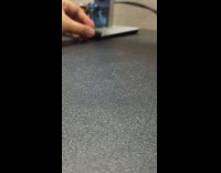 USB adapter rolls smoothly at black table