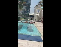 Guy lay on pool read a book