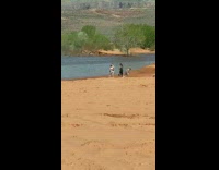 Three woman beach outfit dance riverside desert