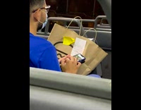 Guy swipes dating app phone bus glasses