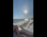 Guy gets poured drink in his mouth then jumps off boat 