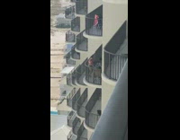 Woman blue underwear tiktok dance balcony apartment