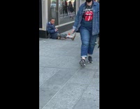 Guy Sits on New York Sidewalk next to Food 