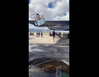 Guy wearing pink speedo thong jogging