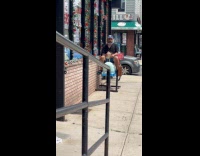 Drunk man riding mechanical whale kids ride 