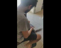 Guy hides treat behind back from cat 