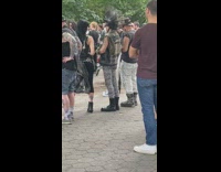 Guy in heavy metal outfit super tall spiked hair