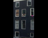 Couple sits on window and sweet with each other